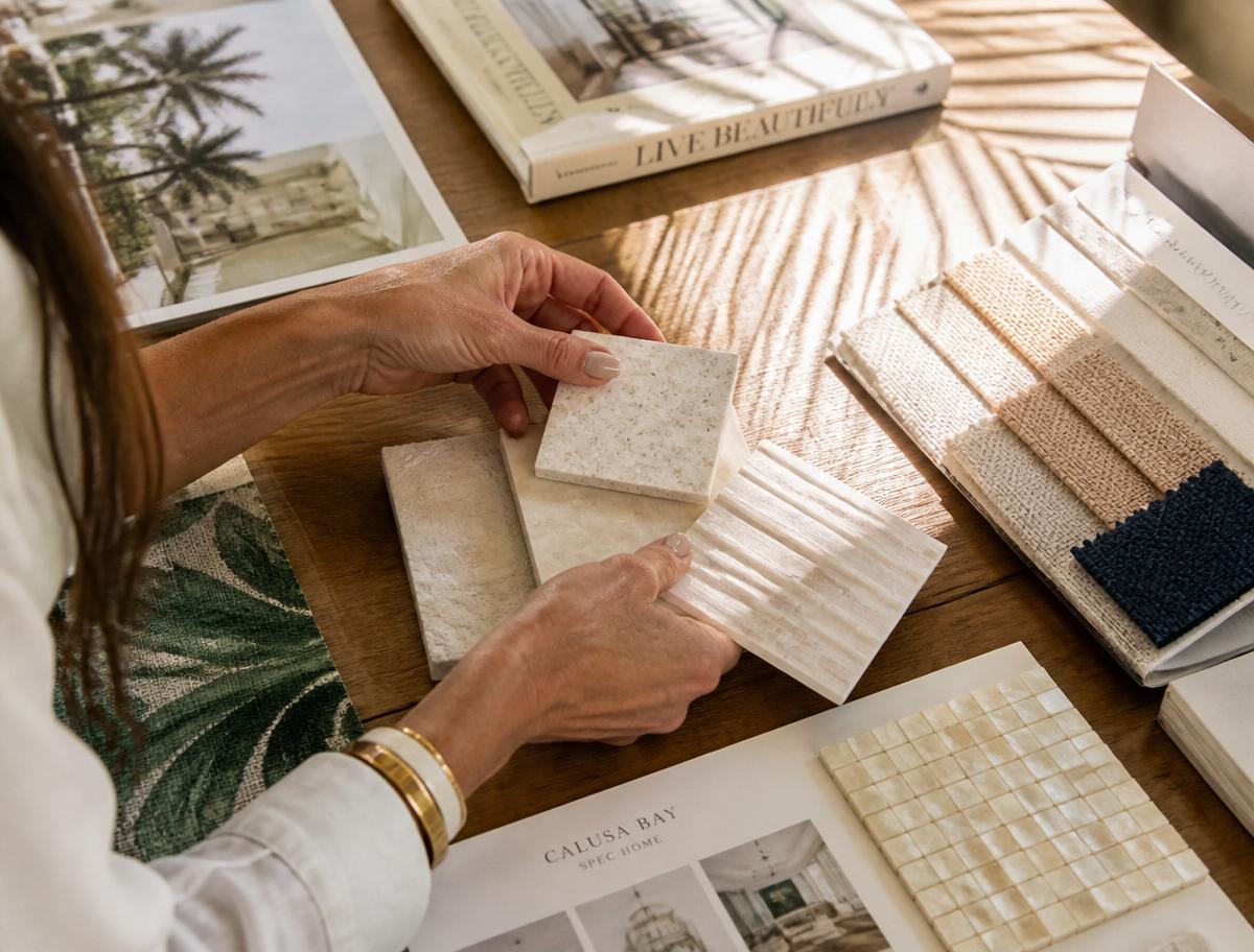 Designer reviewing tile and fabric samples